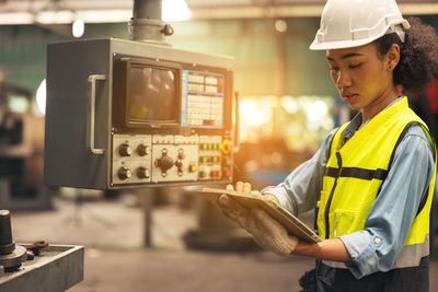 Rear view of man working at construction site