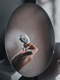 Close-up of hand holding crystal ball