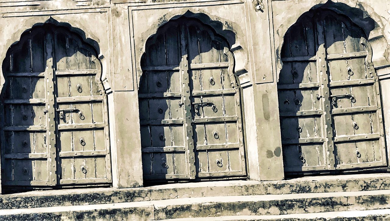 CLOSED DOOR OF OLD HOUSE