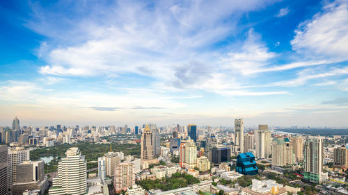 Aerial view of modern buildings in city against sky