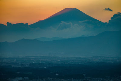 Scenic view of mountains against sky during sunset