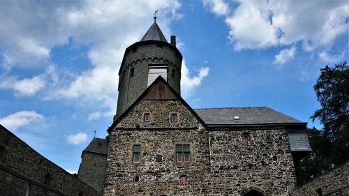 Low angle view of old building against sky