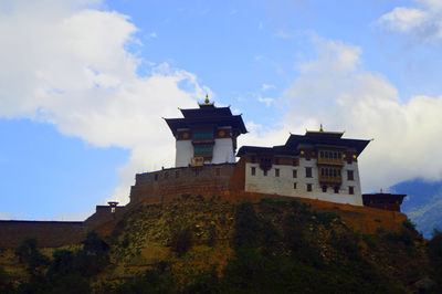 Low angle view of old building against sky