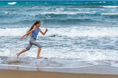 Full length of boy on beach