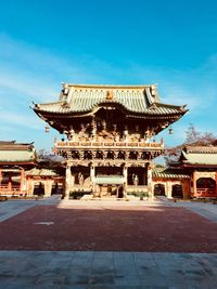 View of temple building against blue sky