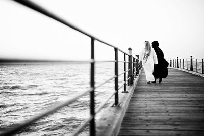Pier on sea against sky