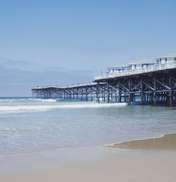 Pier over sea against sky