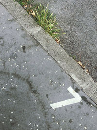 High angle view of arrow sign on road