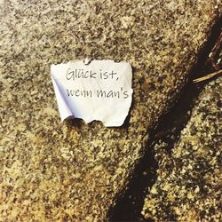 Close-up of text on rocky surface