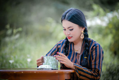 Young woman using mobile phone