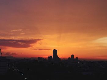 Silhouette of city at sunset