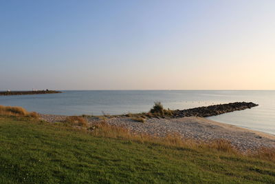 Scenic view of sea against clear sky
