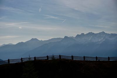 Bridge over mountains against sky