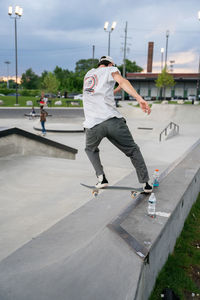 Low section of man skateboarding on skateboard