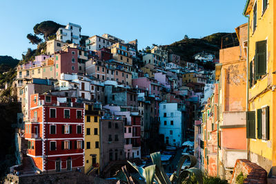 Buildings in city against blue sky