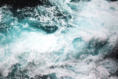 High angle view of flowing water in sea