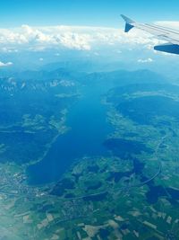 Aerial view of airplane wing over landscape