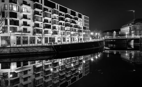 Illuminated buildings in city at night