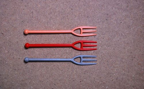 Close-up of plastic forks on table