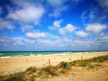 Scenic view of beach against sky