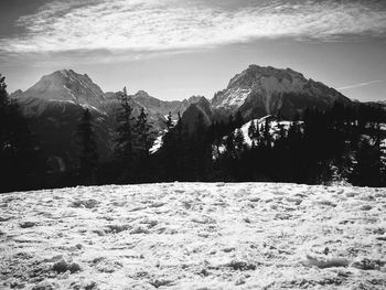 Scenic view of snowcapped mountains against sky