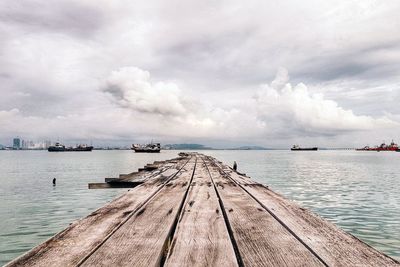 Pier over sea against sky