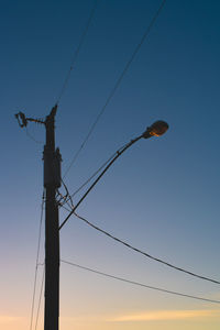 Low angle view of street light against sky