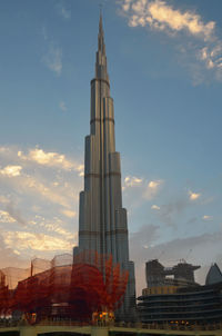 Low angle view of building against cloudy sky