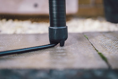 Close-up of chain on footpath