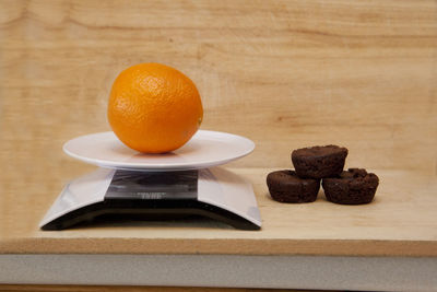 Close-up of orange juice on table