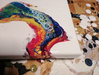 Close-up of multi colored art on table