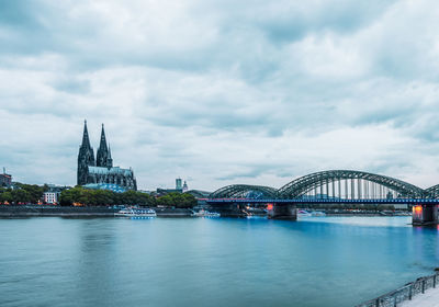 Rhine promenade in cologne with a view of cologne cathedral at the blue hour, germany.