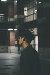 Side view of young man looking away