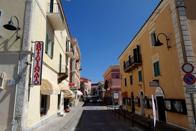 Narrow alley amidst buildings in city