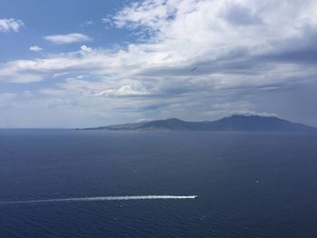 Scenic view of sea against cloudy sky