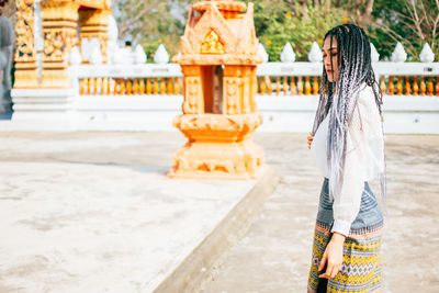 Woman standing in temple