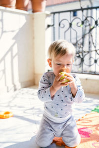 Full length of girl eating food