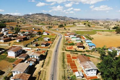 High angle view of buildings in city against sky