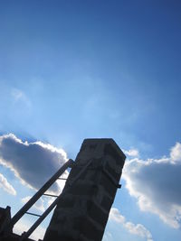 Low angle view of building against blue sky