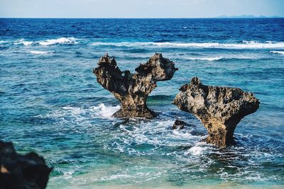 Scenic view of sea against clear blue sky