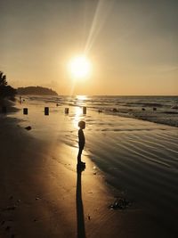 Scenic view of beach against sky during sunset