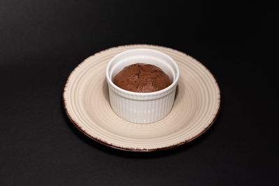 High angle view of drink on table against black background