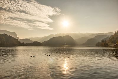 Scenic view of lake against sky during sunset