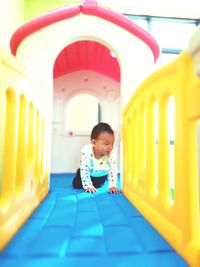 Cute girl playing in corridor