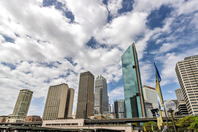 Skyscrapers in city against sky