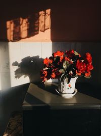 Close-up of flower vase on table at home