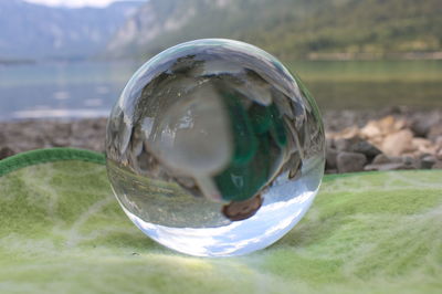 Close-up of crystal ball on glass