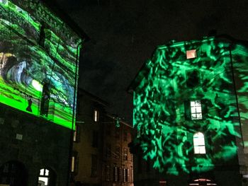 Low angle view of illuminated building at night