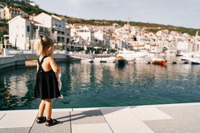 Portrait of young woman walking on street