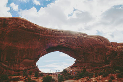 Low angle view of rock formation against sky